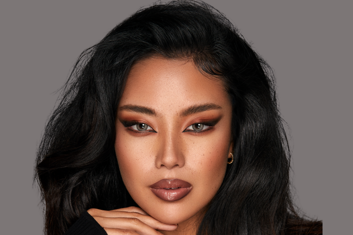 Portrait of a model wearing gray colored contact lenses.